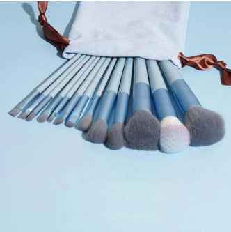 Petra store 13-Piece Makeup Brush Set with soft bristles and blue handles in a white drawstring pouch