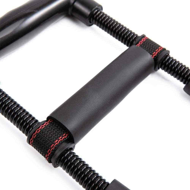 Close-up of black Adjustable Arm Trainer with padded grip and sturdy spring resistance for arm workouts
