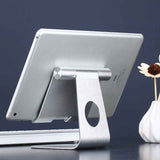 Petra store silver aluminum Stand For iPads and Tablets supporting an iPad in a workspace
