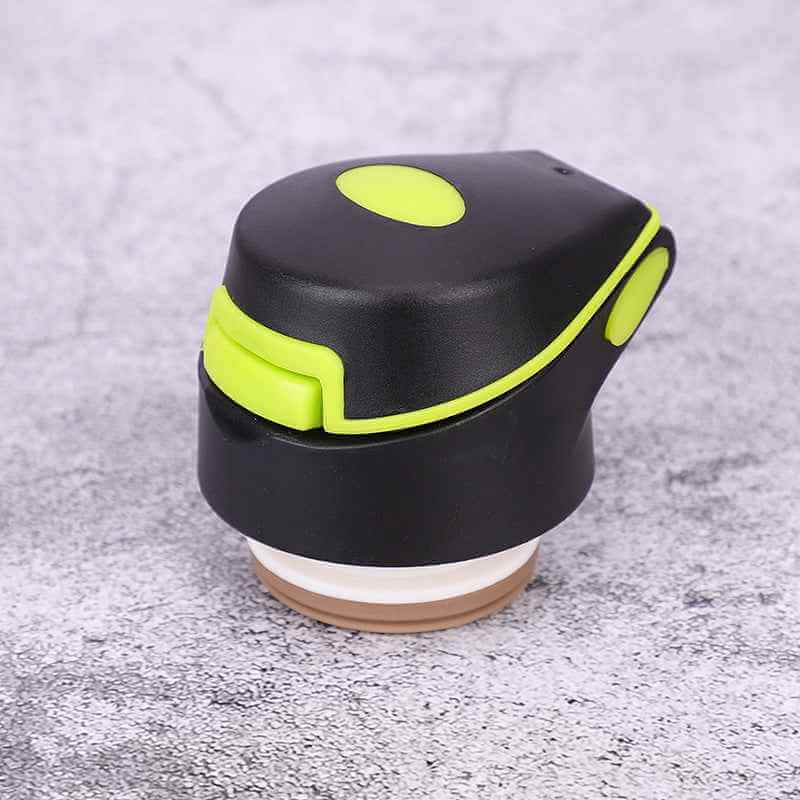 Petra store bike water bottle black cap with green accents and secure locking mechanism