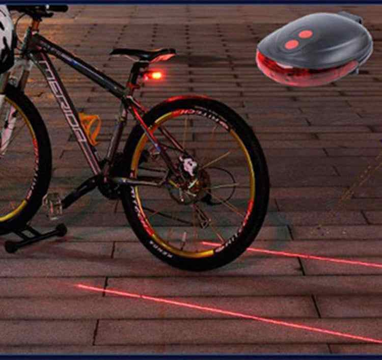 Petra store Bicycle Tail Light attached to bike showing bright red safety lights and laser lane markers