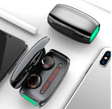Bluetooth earbuds with charging case from Petra store shown next to smartphones and a stylus on a white surface