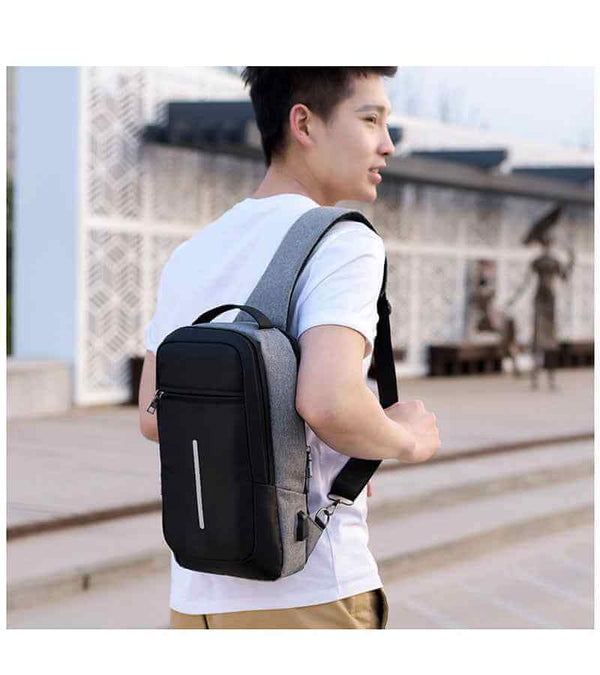 Petra store black and gray chest bag worn by a man for fitness and wellness activities