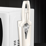 Petra store white compact kitchen scissors with safety sheath stored on microwave side holder