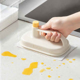 Petra store Cleaning Magic Brush with ergonomic handle cleaning yellow stains from kitchen countertop
