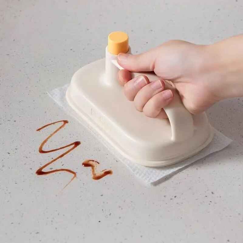 Petra store Cleaning Magic Brush with handle removing stain from countertop surface