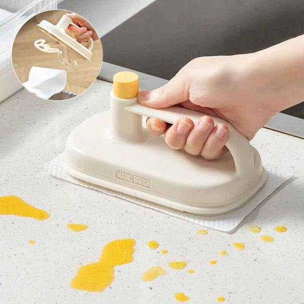 Petra store Cleaning Magic Brush in use on kitchen countertop to clean yellow stains with easy gripping handle