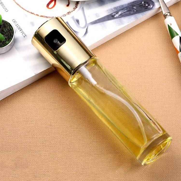 Petra store cooking oil spray bottle with gold top and transparent body for easy oil dispensing