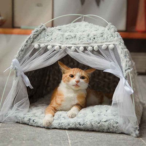 Cozy pet bed for small pets by Petra store featuring soft gray fabric and decorative white curtains