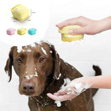 Petra store Dog Bath Brush in yellow used to lather soap on a brown dog during bath time