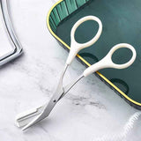Petra store Eyebrow Trimming Knife With Comb featuring white handles and stainless steel blades on a marble surface