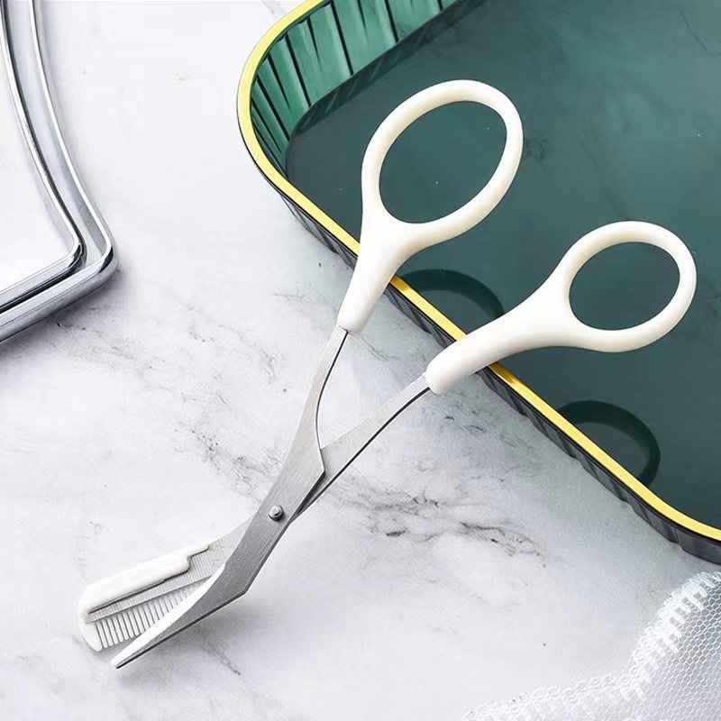 Petra store Eyebrow Trimming Knife With Comb featuring white handles and stainless steel blades on a marble surface