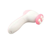 Petra store facial massager in white and pink with four rounded massage nodes for skincare