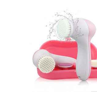 Petra store facial massager with soft bristle brush heads and pink storage case for skincare cleansing