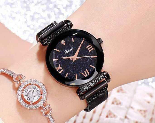 Petra store black fashion watches for women with glittery dial and mesh strap on wrist