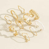 Petra store gold flower ring set featuring delicate floral and pearl designs for fashion accessories