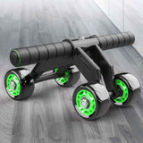 Four-Wheeled Abdominal Roller with black handles and green wheel accents by Petra store on gray wooden floor