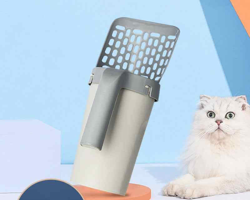 Petra store Cat Litter Shovel Set with gray perforated scoop and easy-grip handle next to a white fluffy cat