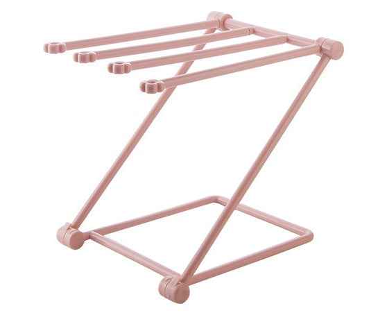 Petra store foldable dishcloth shelf in pink metal with multiple rods for drying and organizing cloths