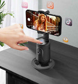Petra store Gimbal Smartphone Holder in black showing a hand pressing the power button with a phone mounted