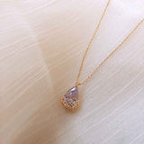 Crystal Water Drop Pendant Necklace with gold chain and floral design from Petra store