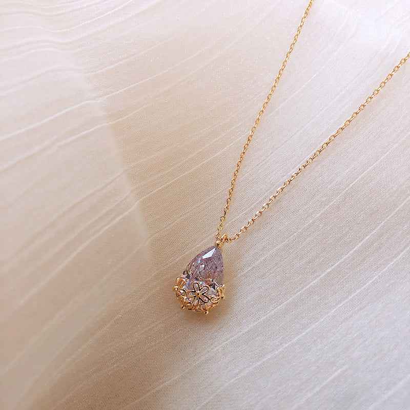 Crystal Water Drop Pendant Necklace with gold chain and floral design from Petra store