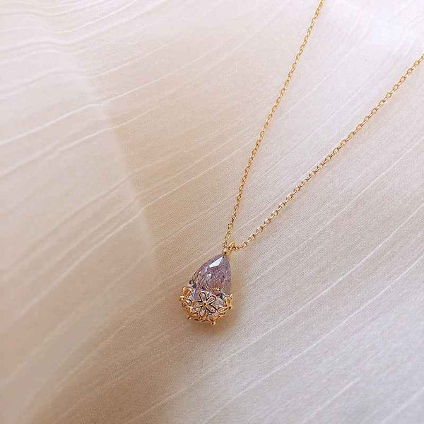 Crystal Water Drop Pendant Necklace with gold chain and floral detailing from Petra store