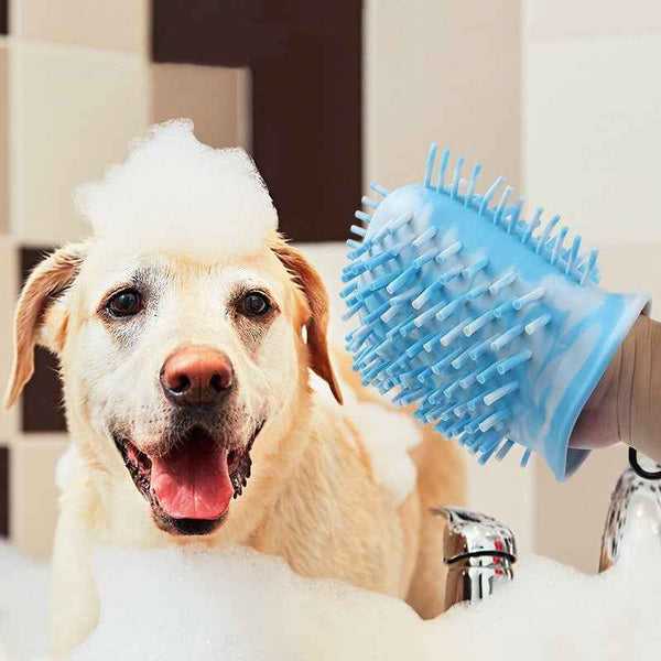 2 In 1 Dog Paw Cleaner blue silicone glove being used to clean bubbly yellow Labrador in bathtub