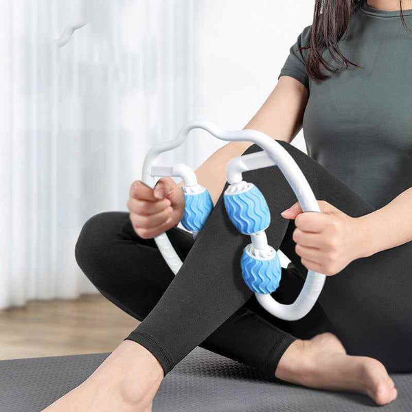 Petra store Leg Massage Roller with blue textured rollers used by woman for muscle relief