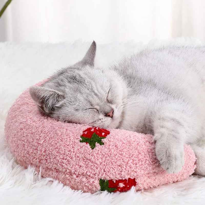 Grey cat sleeping comfortably on a pink Little Pillow For Pets with strawberry design