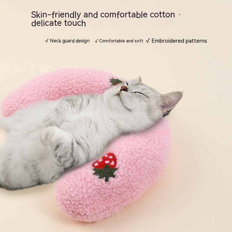 Cat resting comfortably on a pink Little Pillow For Pets with embroidered patterns and soft cotton