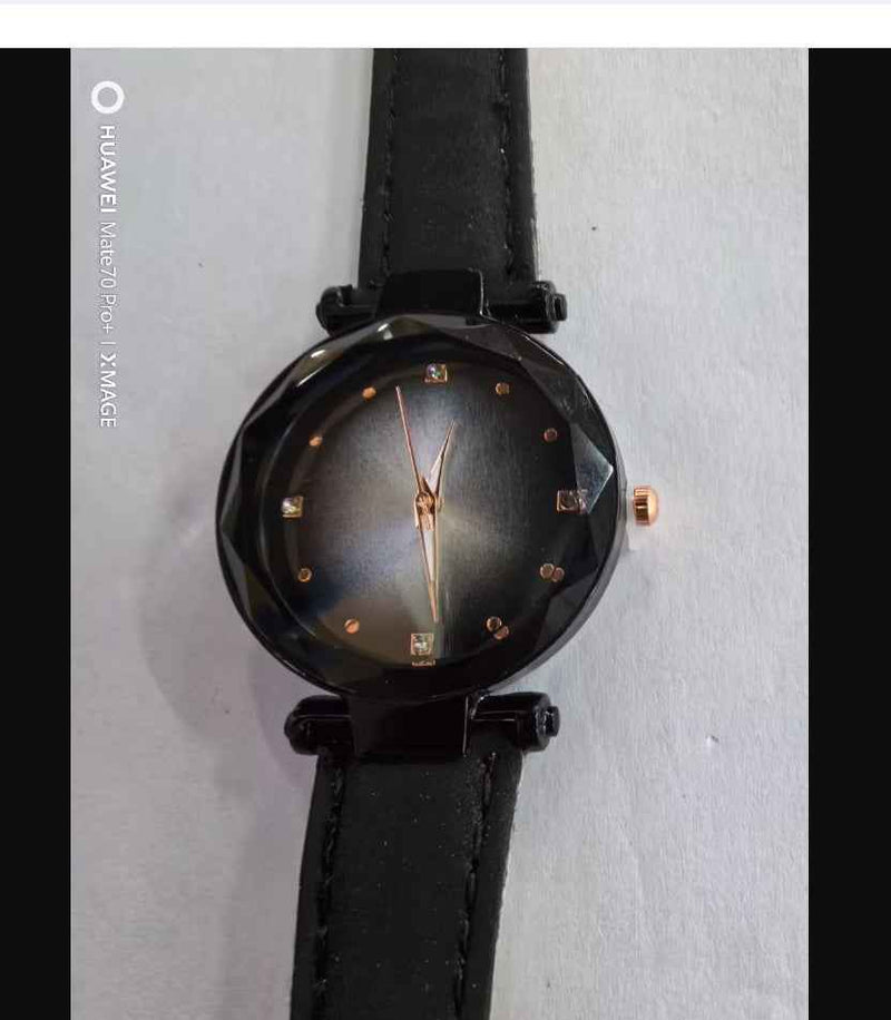 Petra store Rose Gold Watch with black faceted dial rose gold hands and crystal hour markers on black leather strap