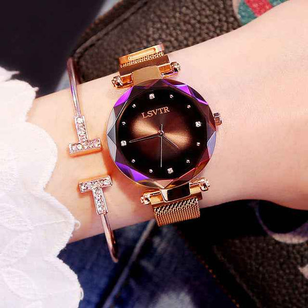 Petra store Rose Gold Watch with faceted purple bezel black crystal dial and mesh strap paired with rhinestone bangle