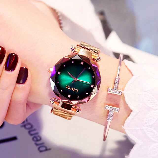 Petra store Rose Gold Watch with faceted green dial and mesh band worn with rhinestone T bracelet