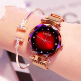 Petra store Rose Gold Watch with faceted crystal bezel red gradient dial and mesh band