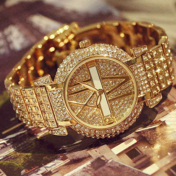 Petra store women's quartz watch with gold tone and sparkling crystals on band and dial