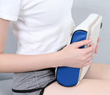 Petra store massage pillow in white and blue held by a person wearing white shirt and gray shorts