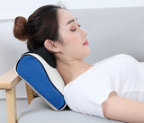 Woman relaxing with Petra store blue and white massage pillow on gray couch for neck support