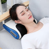Woman relaxing on a gray couch using Petra store blue and black massage pillow for neck comfort