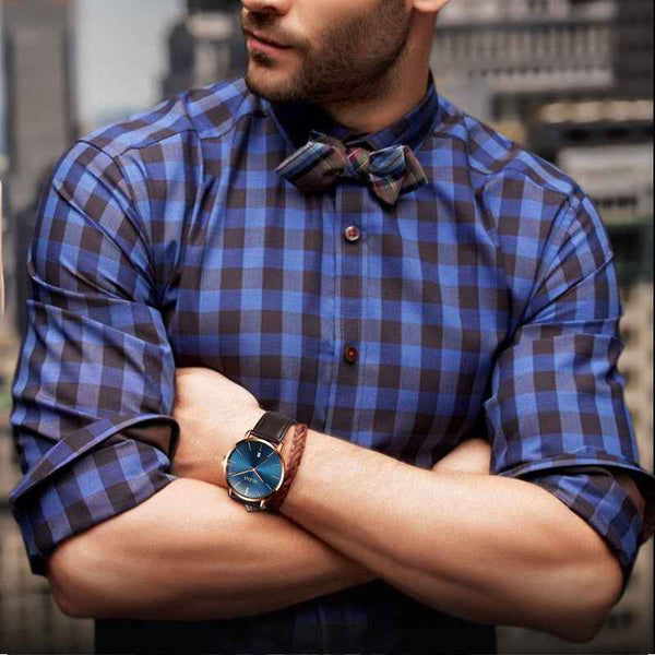 Petra store Leather Sports Watch with blue dial and brown leather strap on man in plaid shirt