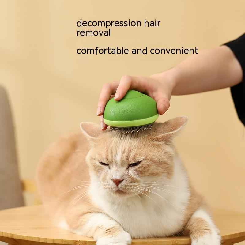 Petra store Pet Hair Brush and Hair Remover in green being used on a relaxed orange and white cat
