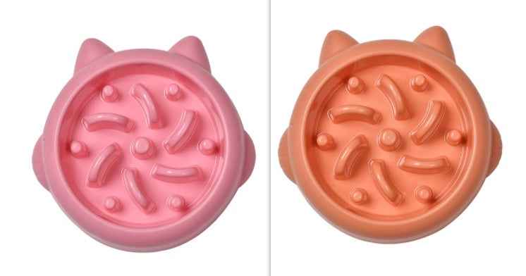 Petra store Pet Slow Feeder Bowl in pink and orange with raised patterns to slow pet eating