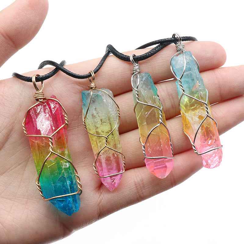 Colorful crystal Pillar Tree Of Life Pendant wrapped in wire on black cords held in hand