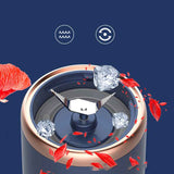 Close-up of Petra store Portable Blender And Mini Juicer stainless steel blades with ice and fruit pieces