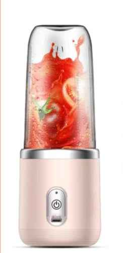 Petra store Portable Blender And Mini Juicer with a pink base blending fresh red fruits and vegetables