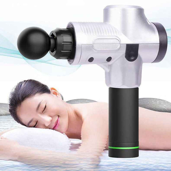 Petra store Portable Body Massager in silver and black with a round head shown with a woman relaxing while receiving a massage