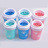 Petra store portable pet paw cleaning tool in blue, pink, and teal with paw print design