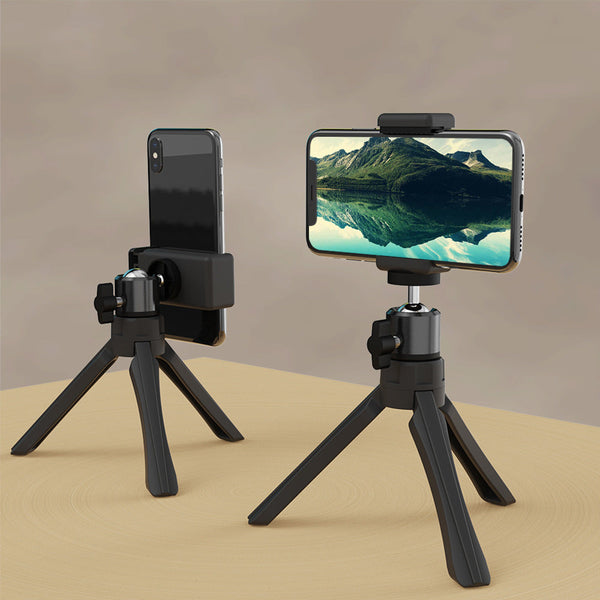 Petra store portable phone tripod in black with adjustable mount holding smartphones on wooden surface