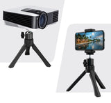 Portable phone tripod from Petra store holding a phone and a projector with adjustable legs