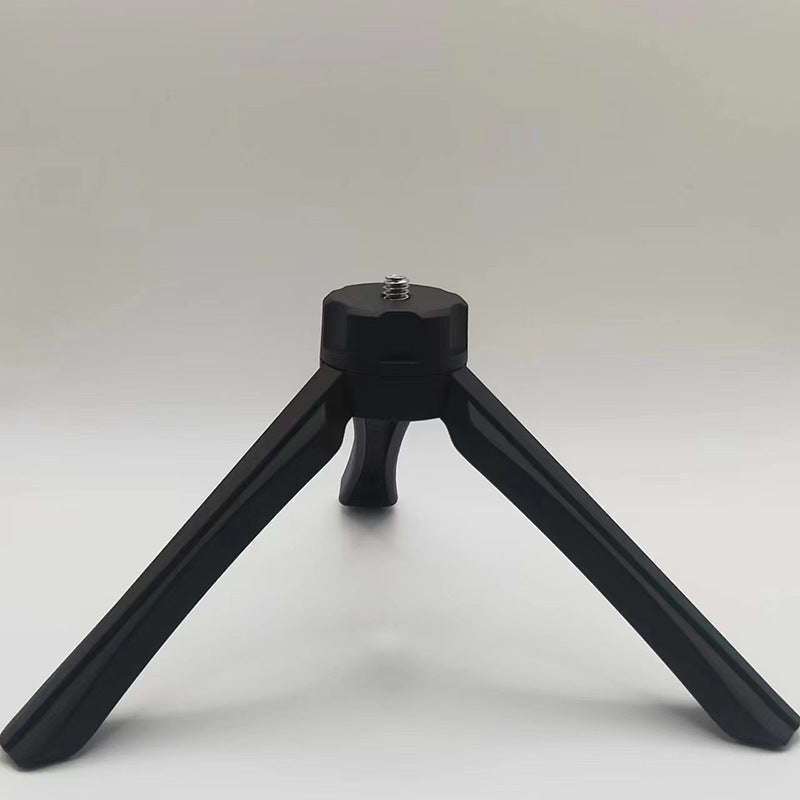 Black portable phone tripod with foldable legs for stable phone support from Petra store